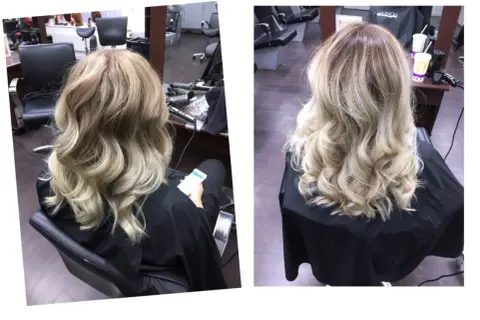 A woman's blonde hair styled in loose waves, viewed from the back.