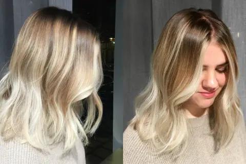 En kvinna med vackert blont hår, mjukt vågigt och med en fin ombre-effekt.
