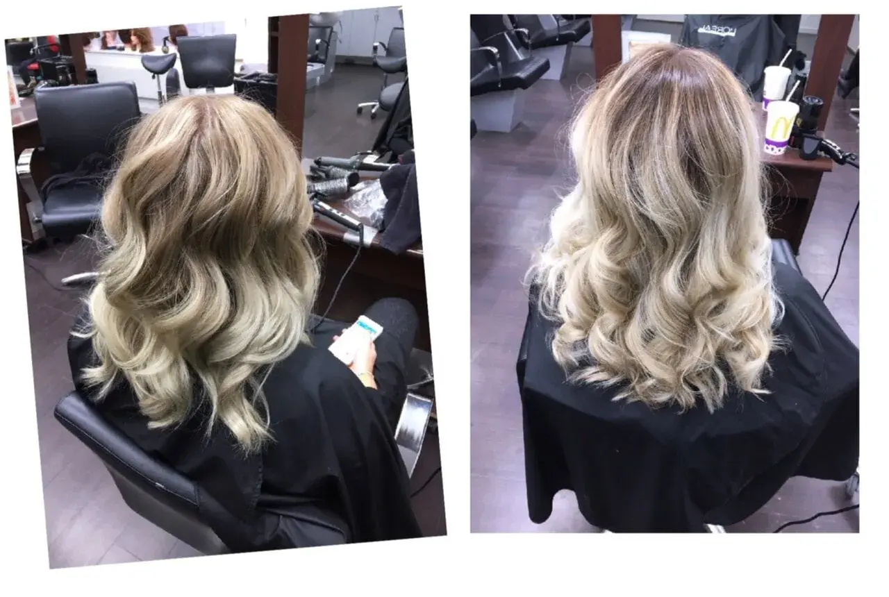 A woman's blonde hair styled in loose waves, viewed from the back.