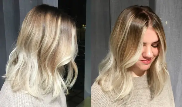 En kvinna med vackert blont hår, mjukt vågigt och med en fin ombre-effekt.